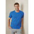 A blue crew neck t-shirt for men, featuring short sleeves and a casual design, with a model standing against a wall.