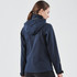 A navy softshell jacket featuring a hood and logo on the collar, shown from the back.