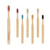 A set of large flat handle toothbrushes in various colours, featuring bamboo handles and different bristle colours.