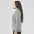 A women's long-sleeve micro pique polo in grey, featuring a collar and a fitted design.