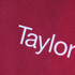 A red non-woven tote bag featuring a logo and a textured surface.
