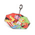 A reversible folding umbrella features a vibrant design with cartoonish fruits, snacks, and playful characters in various colours.