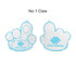 A pair of paw-shaped foam mitts in white with blue outlines and a logo design.