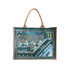 A jute and canvas tote bag featuring a colourful design of a waterfront scene with boats and buildings.