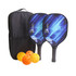 A wooden pickleball set featuring two paddles with a blue design, three orange balls, and a black carrying bag.