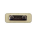 A rectangular wooden badge in beige with a silver magnetic clasp and a caution label.