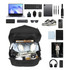 A black convertible backpack to duffel bag filled with a laptop, camera, headphones, notebooks, and various accessories.