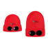 A red beanie with black goggles attached, featuring a logo on the front.