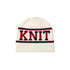 A white Jacquard beanie featuring red and navy blue stripes with a knit design. It has a logo.