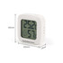 A white mini digital thermometer displaying temperature and humidity levels with a logo on the front.