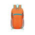An orange packable hiking backpack with turquoise accents and mesh side pockets. Features multiple zippers for storage.