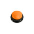 An orange button with a glossy finish, set on a black base. The button is round and prominent.