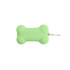 A green silicone bone-shaped dog poop bag dispenser with a clip for easy attachment.