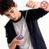 A boy is playing with a purple yoyo, pulling the string down as he focuses on his trick.