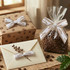 Adhesive bows in white and brown sit on a gift box and a packaged bag of coffee beans, enhancing the rustic presentation.