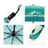 A compact folding umbrella featuring a turquoise and white design with a mountainous pattern and a handle with a logo.