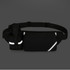 A black fanny pack with a bottle holder, featuring reflective accents and a zippered compartment.