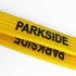 A yellow tubular lanyard featuring black lettering and a logo, ideal for events and exhibitions.