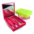A pink and green plastic box containing five makeup brushes and a mirror.