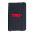 A black notebook with an elastic band closure and a red logo on the front.