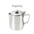 A stainless steel milk frothing pitcher with a lid, featuring a handle and a branded logo.