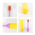 A foldable soft bristle toothbrush in pink and yellow, featuring a protective case and soft bristles.