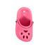 A pink paw-shaped clog shoe fridge magnet features ventilation holes and a strap, complete with a logo.