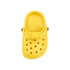 A yellow clog shoe fridge magnet with ventilation holes and a strap, featuring a logo.