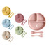 A set of silicone kids suction plates in pastel colours, featuring divided sections and accompanying utensils.