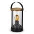 A black lantern with a glass body and wooden top, featuring a vintage-style bulb inside.