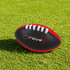 A Mini Aussie Rules Ball in black with red accents, featuring white laces and a logo.