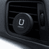A round, black magnetic car vent mount, designed for holding phones, attached to a vehicle vent.