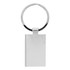 A silver keychain with a rectangular tag and a circular keyring. It features a smooth, shiny surface.