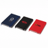 A set of three notebooks in navy, black, and red, each with a logo on the cover. Each notebook features a ribbon bookmark.
