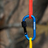 A blue D-shaped screw lock keychain attached to red and yellow ropes, featuring a logo.