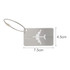 A silver luggage tag in the shape of an airplane with a wire attachment. Dimensions are 7.5 cm by 4.5 cm.