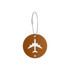 A round, brown luggage tag with a white airplane design and a metal wire attachment.