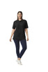 A black Gildan Hammer Adult Double Pique Polo, styled with a woman wearing navy trousers and sneakers.