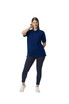 A woman wearing a navy blue Gildan Hammer Adult Double Pique Polo, paired with dark leggings and white sneakers.