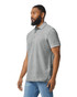 A grey Gildan Hammer Adult Double Pique Polo, featuring a collar and short sleeves, worn by a man.