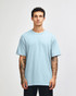 A lightweight, unisex t-shirt in light blue, made from heavyweight cotton, featuring a simple design.