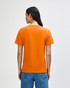 An orange heavyweight cotton unisex T-shirt displayed from the back, with a relaxed fit and short sleeves.