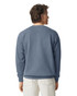 A crewneck sweatshirt in a muted blue colour, featuring a simple design and a logo on the back.