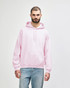 A pink Gildan Heavy Blend adult hooded sweatshirt with a front pocket and a logo.