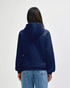 A navy blue hooded sweatshirt with a large hood, view from the back, featuring a logo on the upper back.
