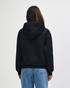 A back view of a black Gildan Heavy Blend hooded sweatshirt, featuring a hood and a plain design.