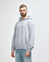 A grey hooded sweatshirt with a front pocket and a drawstring hood, featuring a logo on the chest.