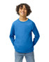 A blue Gildan Heavy Cotton youth long sleeve T-shirt worn by a smiling child, with hands in pockets.