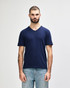 A navy adult v-neck t-shirt displayed on a male model, featuring a subtle logo.