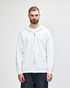 A white full zip hooded sweatshirt on a model, featuring a front pocket and a drawstring hood.